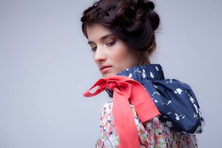 Young beautiful stylish girl posing in studio.の写真素材