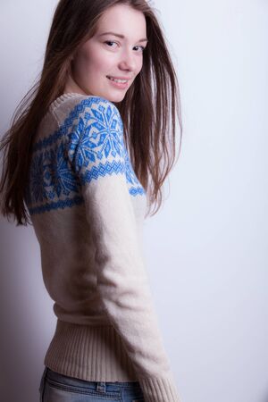 Young beautiful stylish girl posing in studio.の写真素材