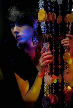 Young beautiful stylish girl posing in studio.の写真素材