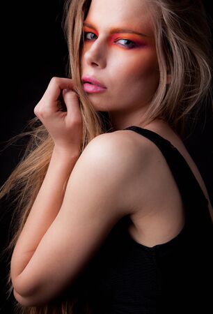 Young beautiful stylish girl posing in studio.の写真素材