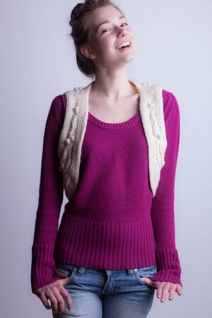 Young beautiful stylish girl posing in studio.の写真素材