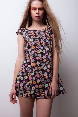 Young beautiful stylish girl posing in studio.の写真素材