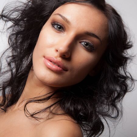 Young beautiful stylish girl posing in studio.の写真素材