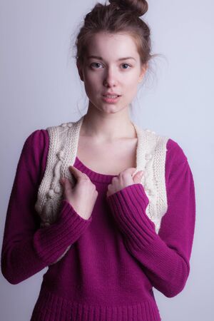 Young beautiful stylish girl posing in studio.の写真素材