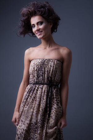 Young beautiful stylish girl posing in studio.の写真素材