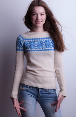 Young beautiful stylish girl posing in studio.の写真素材