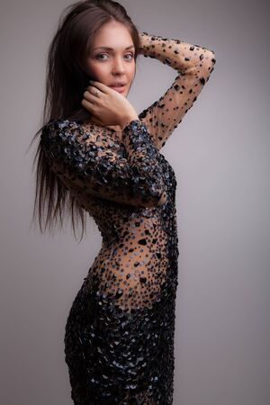 Young beautiful stylish girl posing in studio.の写真素材