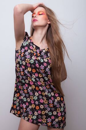 Young beautiful stylish girl posing in studio.の写真素材