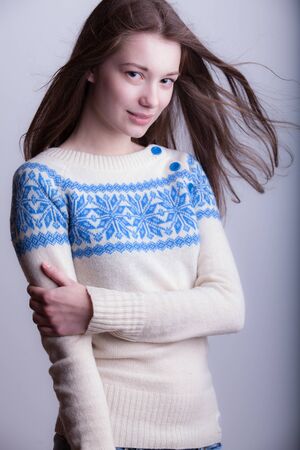 Young beautiful stylish girl posing in studio.の写真素材
