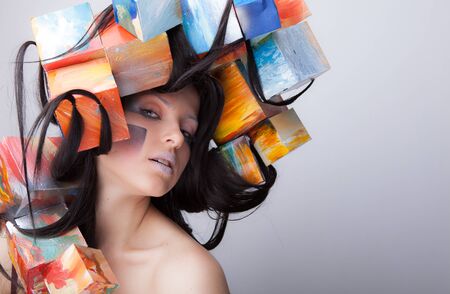 Young beautiful stylish girl posing in studio.の写真素材