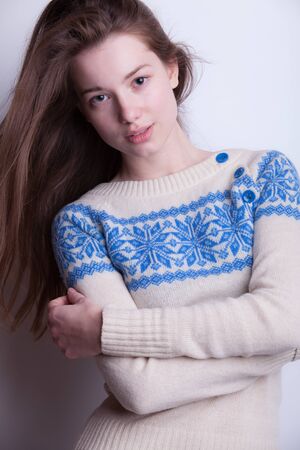 Young beautiful stylish girl posing in studio.の写真素材