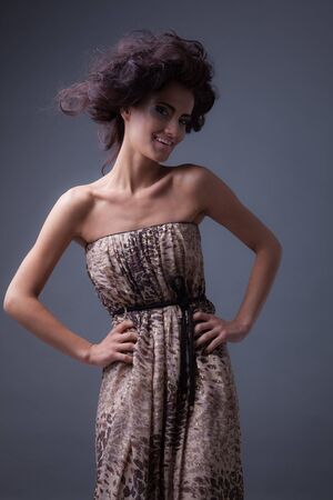 Young beautiful stylish girl posing in studio.の写真素材