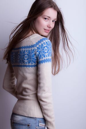 Young beautiful stylish girl posing in studio.の写真素材