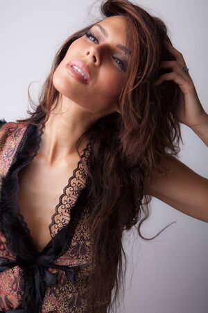 Young beautiful stylish girl posing in studio.の写真素材