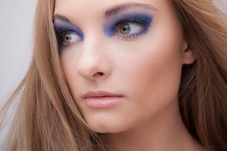 Young beautiful stylish girl posing in studio.の写真素材