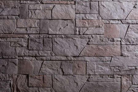 Decorative stone wall as background.