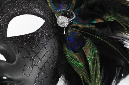 Elaborate Mardi Gras Mask with diamond ring and oeacock feathersの写真素材