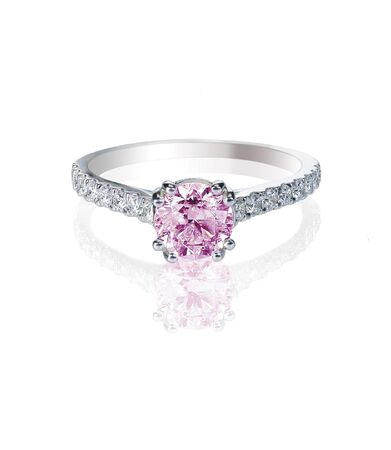 pink diamond engagement wedding ring isolated on whiteの写真素材
