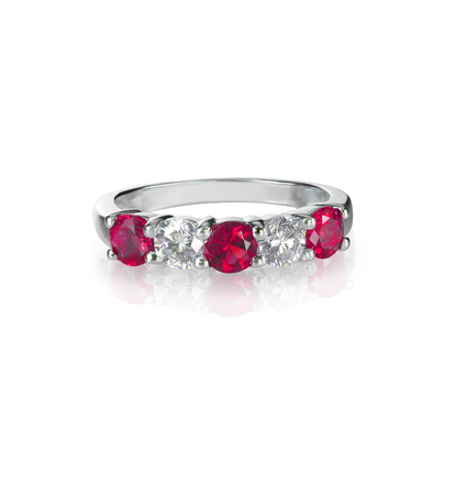 Ruby and diamond wedding anniversary band ring isolated on whiteの写真素材
