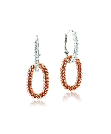 Rose gold and white gold diamond earrings isolated on whiteの写真素材