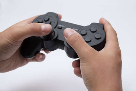 Hands holding black gamepad (Isolated)