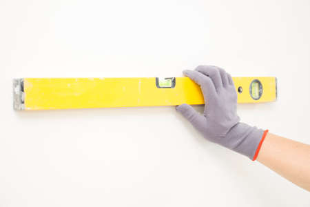 Measurement of a white wallの写真素材