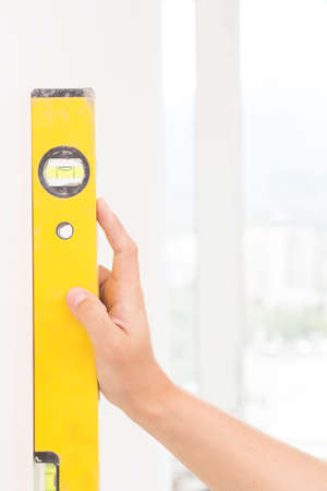 Measurement of a white wallの写真素材