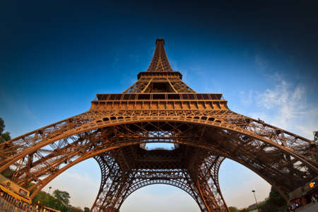 PARIS, circa 2015 - A low angle fisheye shot of the Eiffel Tower in Paris, France, against a clean blue skyのeditorial素材