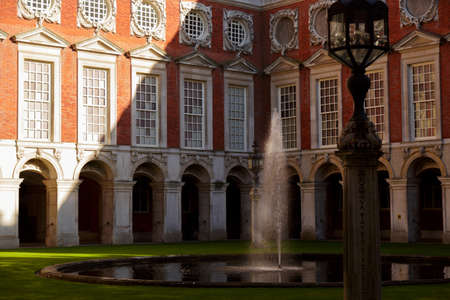 LONDON, circa 2016 - Telephoto shot of the inner fountain and facade of the Hampton Court Palace in London, England, UKのeditorial素材