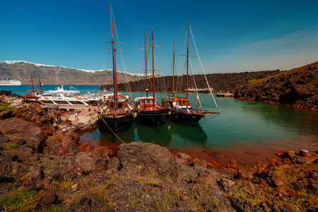 SANTORINI, circa 2015 - A panoramic wide shot showing the volcanic desert island of Thirassia near the popular Greek island of Santoriniのeditorial素材
