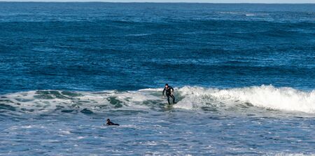 Sport surfing on the beach of zurriola located in san sebastian spain