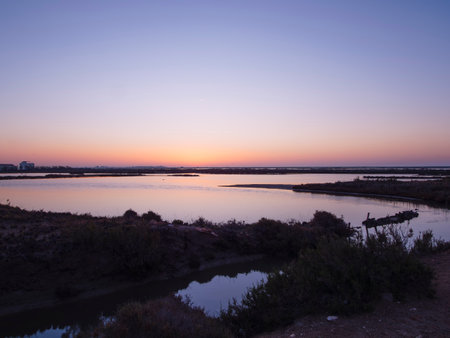 Sunset on the river in a small village in the Alentejo region, Portugalの写真素材