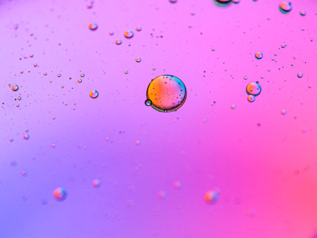Oil drops on water surface. Colorful abstract background. Macro shot.