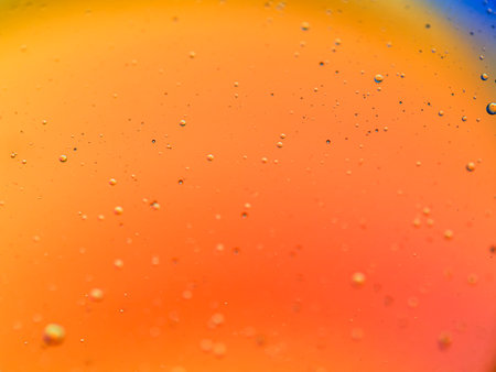 abstract orange and blue background with water drops, macro photography.の写真素材