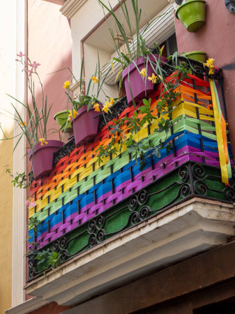 Colorful flower pots on the balcony of a building in Lisbon, Portugalの写真素材