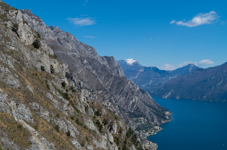 Cliffs of the mountains at the seaside of the Lago di Garda near Limone, Italyの写真素材