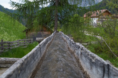 Original wooden irrigation water channel of a mill in south tyrol, italyの写真素材