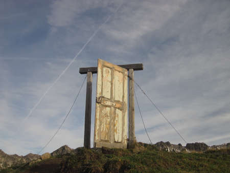 Old wooden door in the mountains, Door to heaven, Oberstdorf, Allgau, Germanyの写真素材