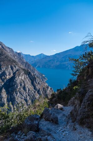 Beautiful view on Lake Garda from a hiking path at the mountainside, Italyの写真素材