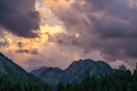 Stormy and dramatic clouds over the mountains near Oberstdorf, Allgau, Germanyの写真素材