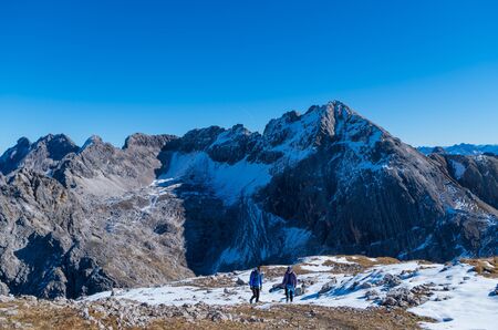 Man and woman mountaineering in Allgau Alps near Oberstdorf, Allgau, Germanyの写真素材