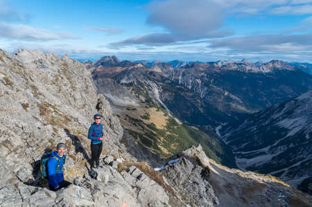 Man and woman mountaineering in Allgau Alps near Oberstdorf, Allgau, Germanyの写真素材