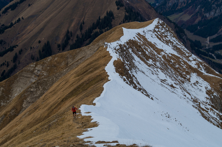 Man trailrunning in the mountains of Allgau near Oberstdorf, Oberallgau, Germanyの写真素材