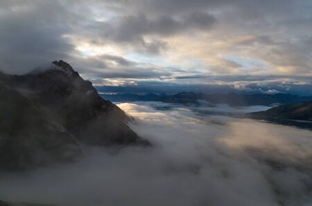 Sunrise with foggy sky in the Lechtal Alps, North Tyrol, Austriaの写真素材