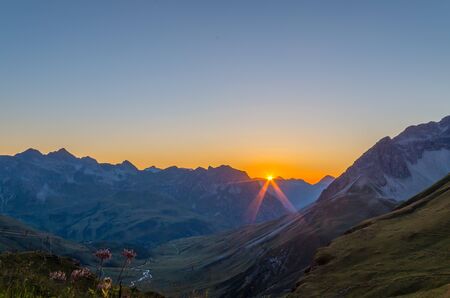 Beautiful orange sunset in the Lechtal Alps, view from the Stuttgart hut, Austriaの写真素材