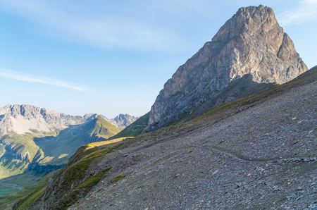 Hiking on a scree field in the mountains of Lechtal Alps, North Tyrol, Austriaの写真素材