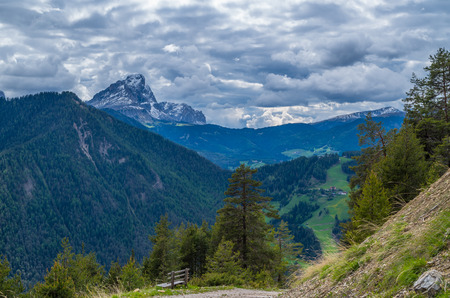Dramatic clouds over mountain Peitlerkofel in south tyrol, near San Vigilio, Italyの写真素材