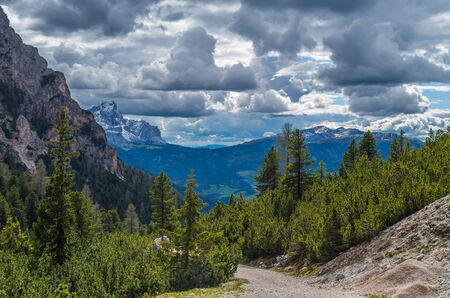 Dramatic clouds over mountain Peitlerkofel in south tyrol, near San Vigilio, Italyの写真素材