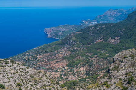 Panorama of Deia and the beautiful coastloine from the mountains of Tramuntana, Baleares, Spainの写真素材