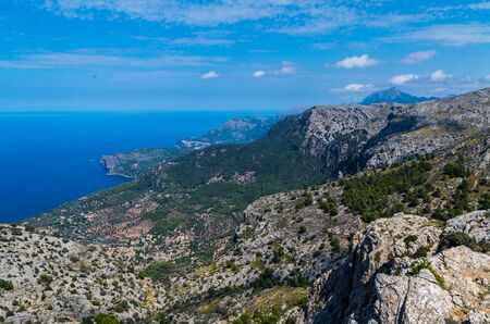 Panorama of Deia and the beautiful coastloine from the mountains of Tramuntana, Baleares, Spainの写真素材